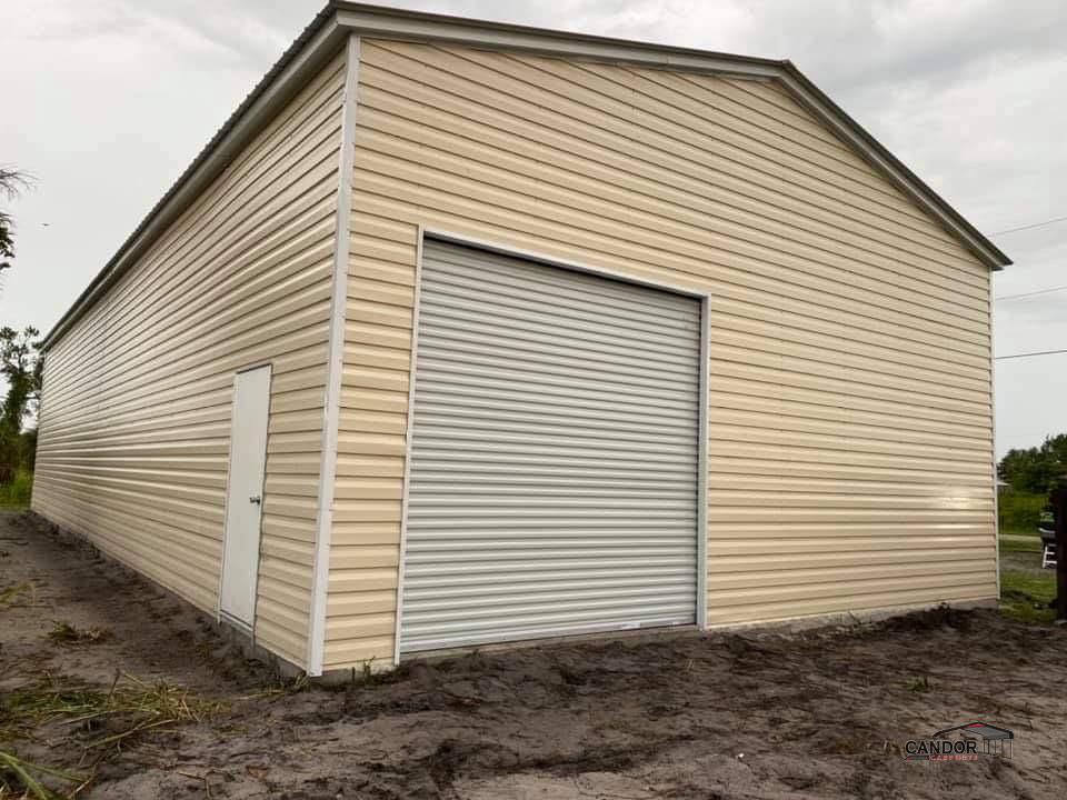 30'w x 50'd x 14'h Vertical Roof with Lap Siding with One 10'x10' Roll-Up Door