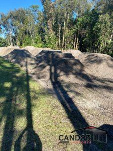 PHOTO 1 - Site Prep - Structural Fill Delivered Ready to be Spread & Compacted