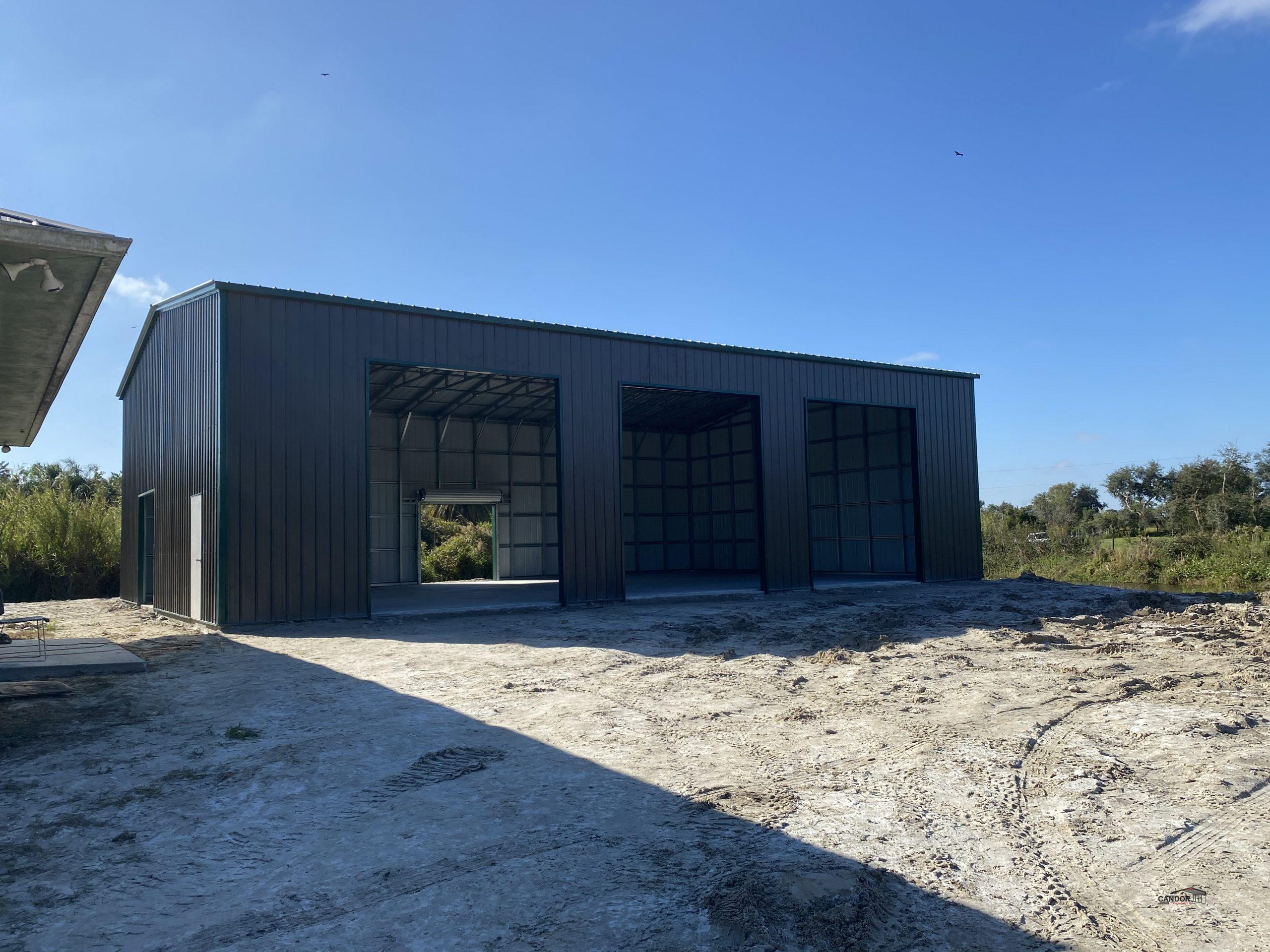 PHOTO 2 - 40'w x 60'd x 16'h Vertical Roof Vertical Sides Doors Open & Closed