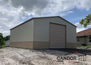 Vertical Roof & Vertical Sides 30'w x 40'd x 14' with one 14'x14' Roll-Up Door with Deluxe Wainscot Upgrade (Two-Tone Paint)